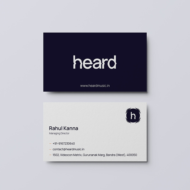 A business card featuring the word "heard" prominently displayed on its surface.